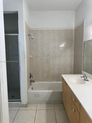 a spacious bathroom with a bathtub sink and toilet