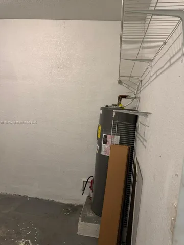 a view of storage and utility room with utility room