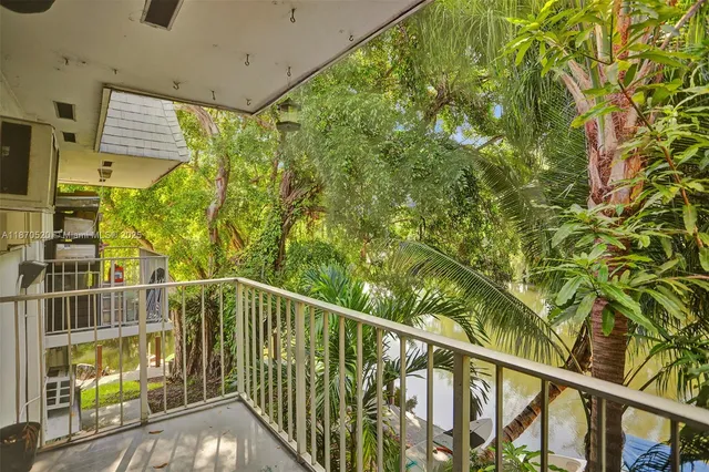 a view of balcony with furniture