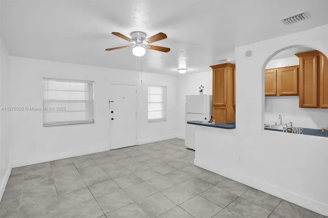 a view of a livingroom with wooden cabinets