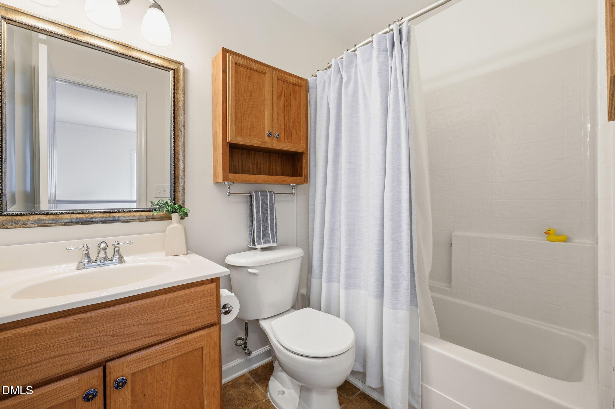 5629 Enoree Lane Raleigh, NC 27616 - Photo 28 of 38 a bathroom with a sink toilet and shower
