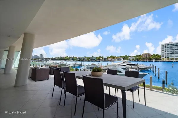 a view of swimming pool with outdoor seating and plants
