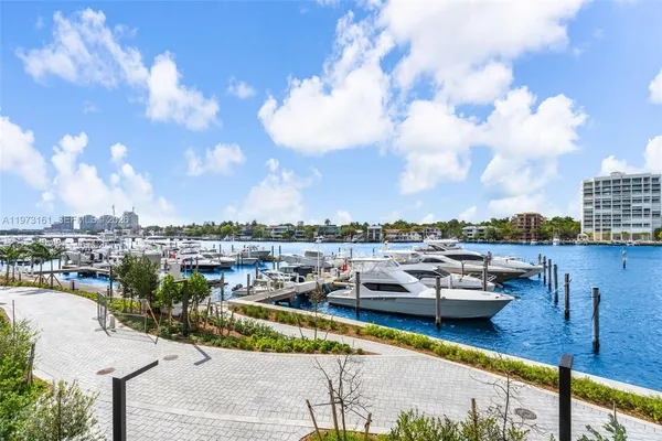 a bathroom with a glass shower door and mirror