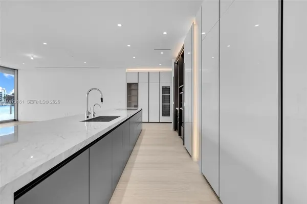 a view of an empty room with glass door