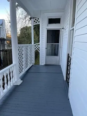 a view of a porch of a house