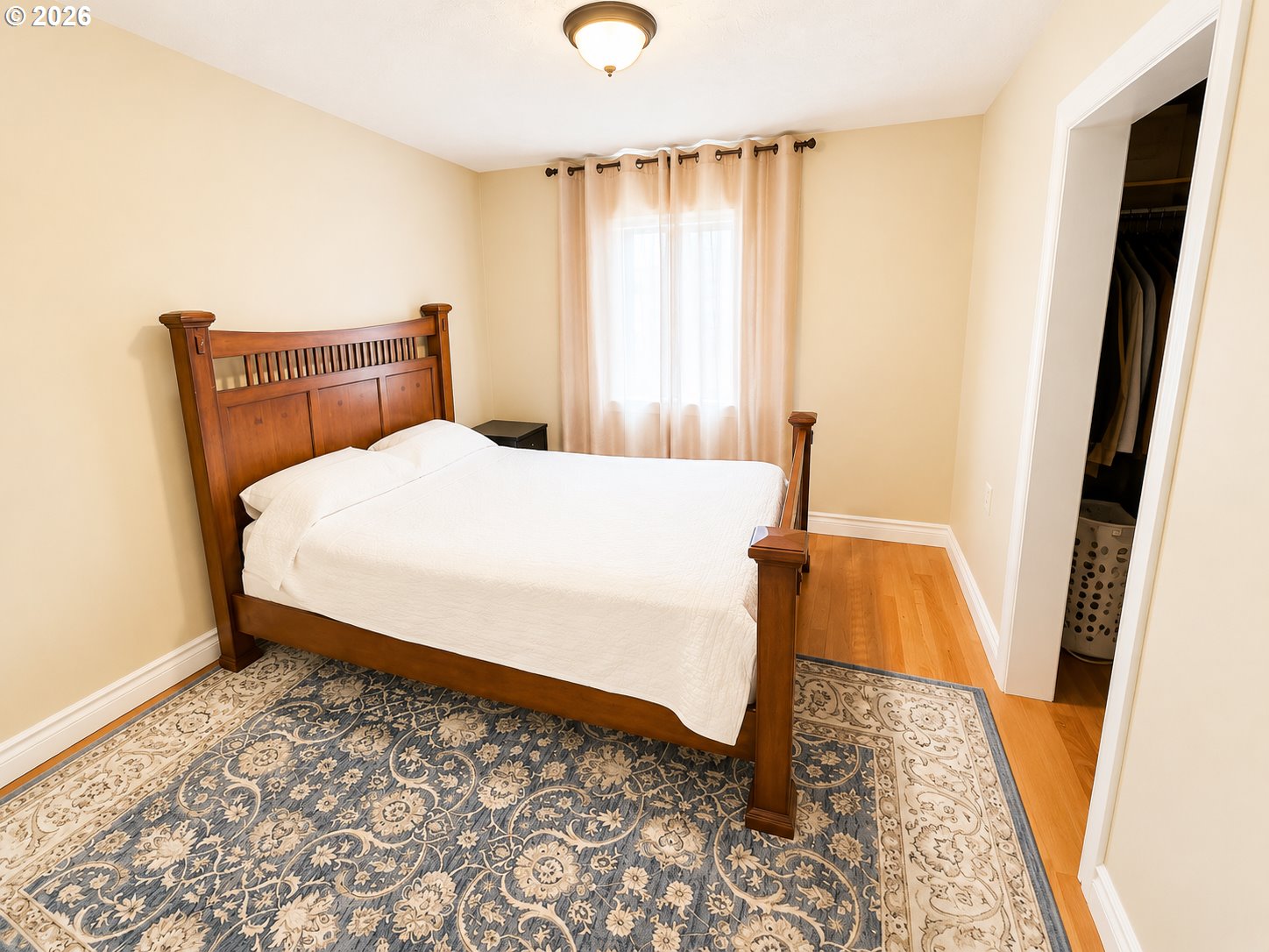 2775 Molalla Road Woodburn, OR 97071 - Photo 30 of 40 a bedroom with a bed and wooden floor