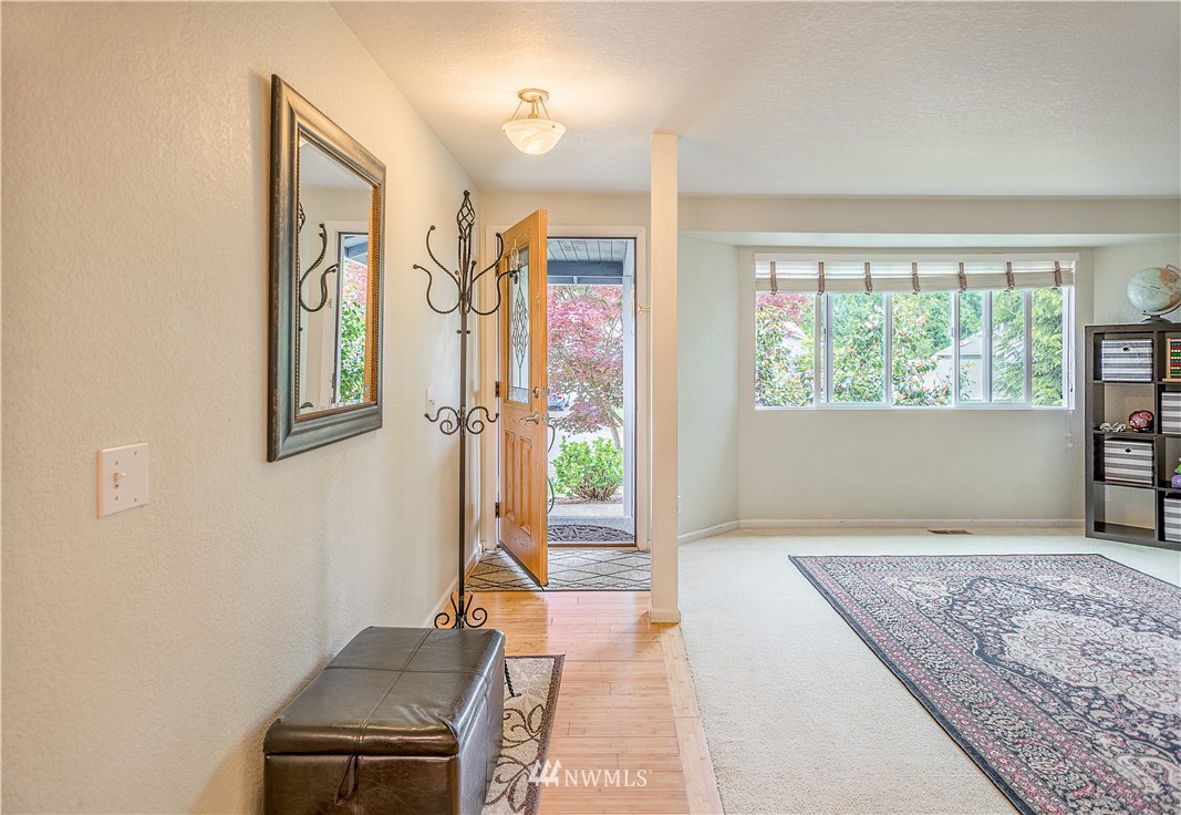 318 161st Place Southeast Bothell, WA 98012 - Photo 2 of 24 a living room with a couch and a window