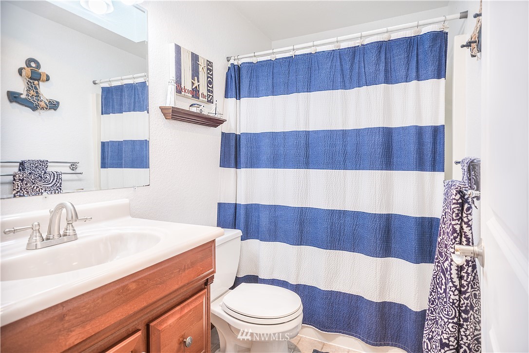 318 161st Place Southeast Bothell, WA 98012 - Photo 12 of 24 a bathroom with a sink and a mirror