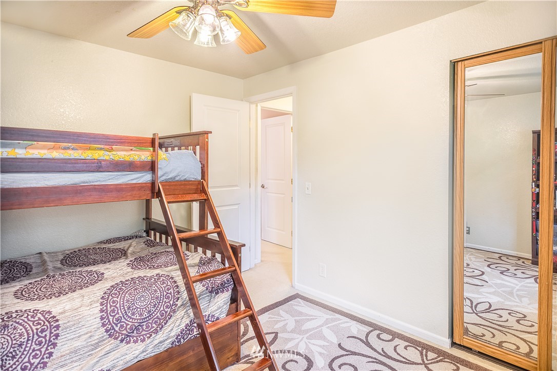 318 161st Place Southeast Bothell, WA 98012 - Photo 14 of 24 a bed room with a bed and a window