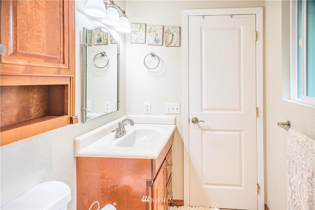 318 161st Place Southeast Bothell, WA 98012 - Photo 15 of 24 a bathroom with a sink and a mirror