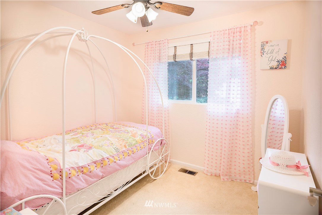 318 161st Place Southeast Bothell, WA 98012 - Photo 17 of 24 a bedroom with a bed and a window