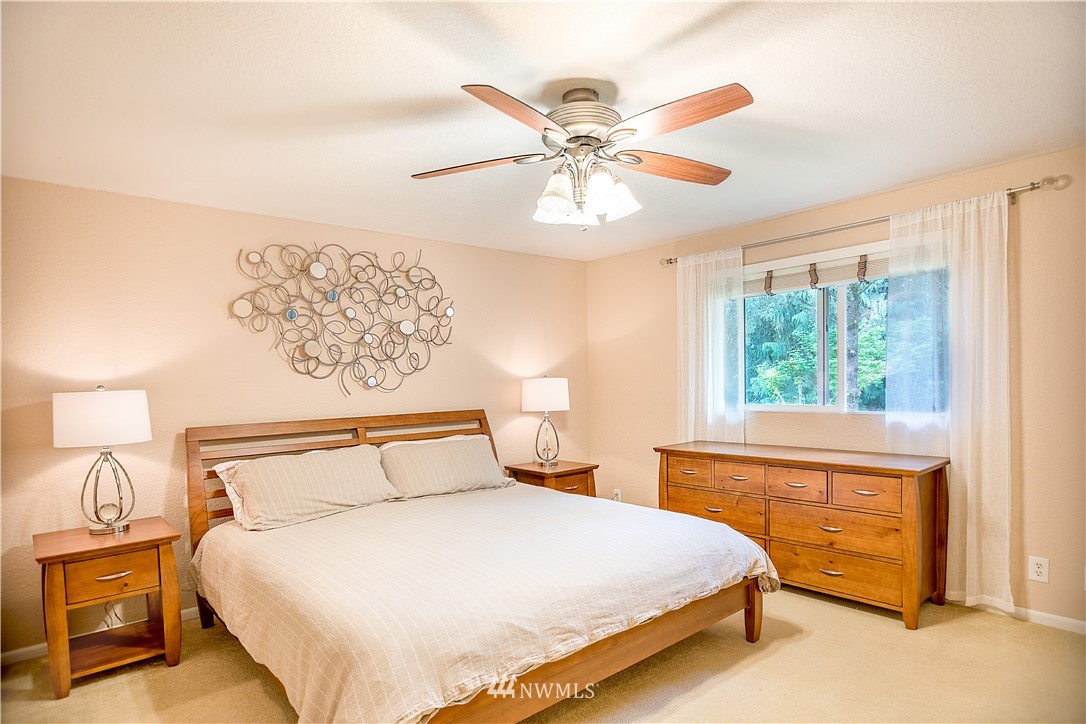 318 161st Place Southeast Bothell, WA 98012 - Photo 19 of 24 a bedroom with a large bed and a window