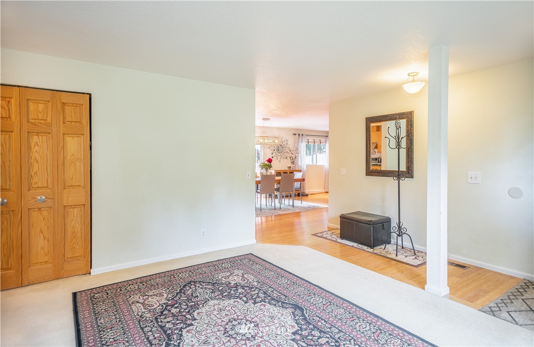 318 161st Place Southeast Bothell, WA 98012 - Photo 3 of 24 a view of a bedroom with wooden floor and cabinet