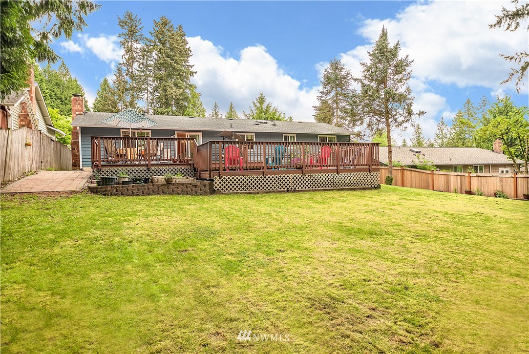 318 161st Place Southeast Bothell, WA 98012 - Photo 24 of 24 a view of a house with a big yard and large trees