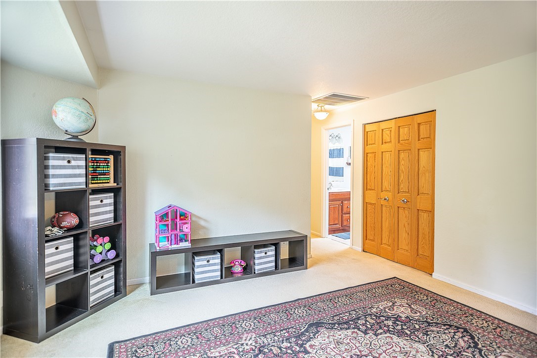 318 161st Place Southeast Bothell, WA 98012 - Photo 4 of 24 a view of a livingroom with shelves