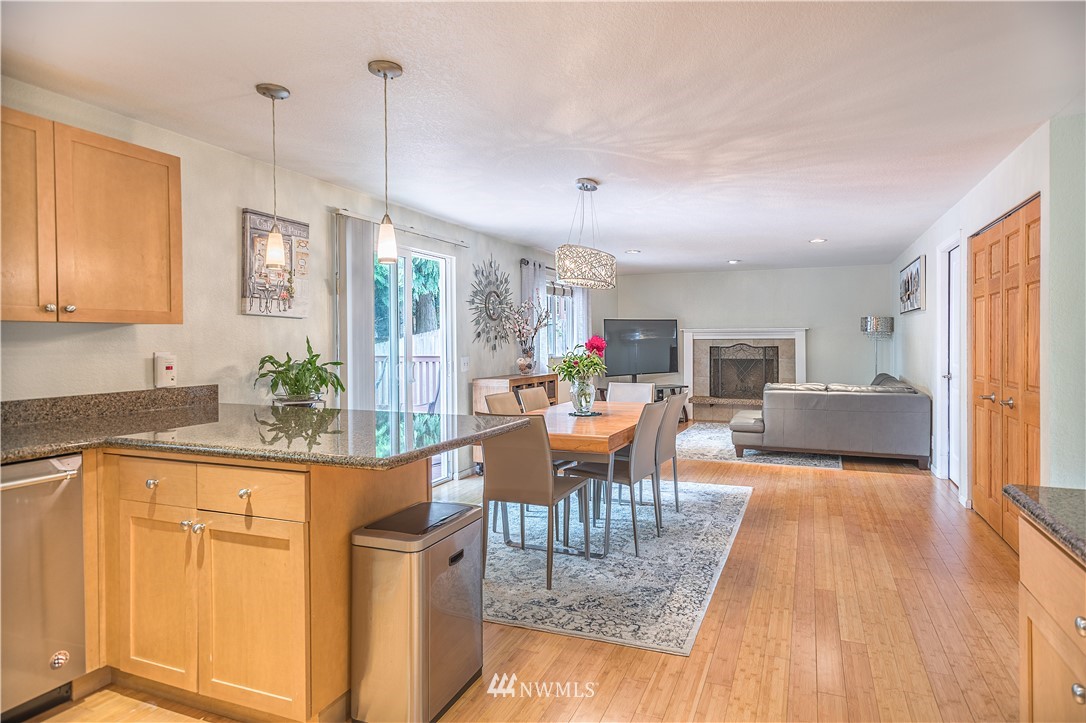 318 161st Place Southeast Bothell, WA 98012 - Photo 6 of 24 a view of a dining room with furniture window and wooden floor