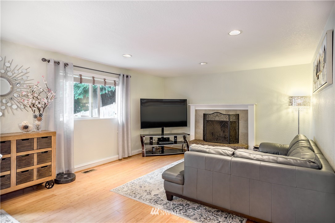 318 161st Place Southeast Bothell, WA 98012 - Photo 10 of 24 a living room with furniture and a flat screen tv
