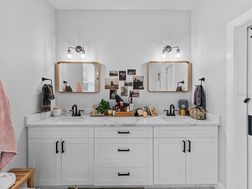 3103 West Leroy Street Tampa, FL 33607 - Photo 13 of 29 a view of cabinets and sink in a bathroom