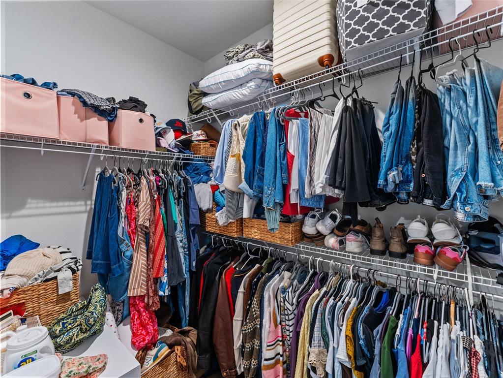 3103 West Leroy Street Tampa, FL 33607 - Photo 16 of 29 a view of walk in closet with clothes
