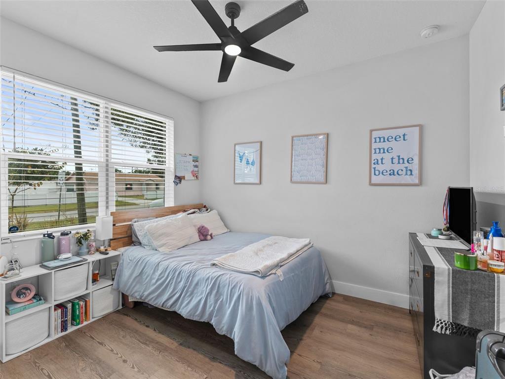 3103 West Leroy Street Tampa, FL 33607 - Photo 17 of 29 a bedroom with a bed bookshelf and a window