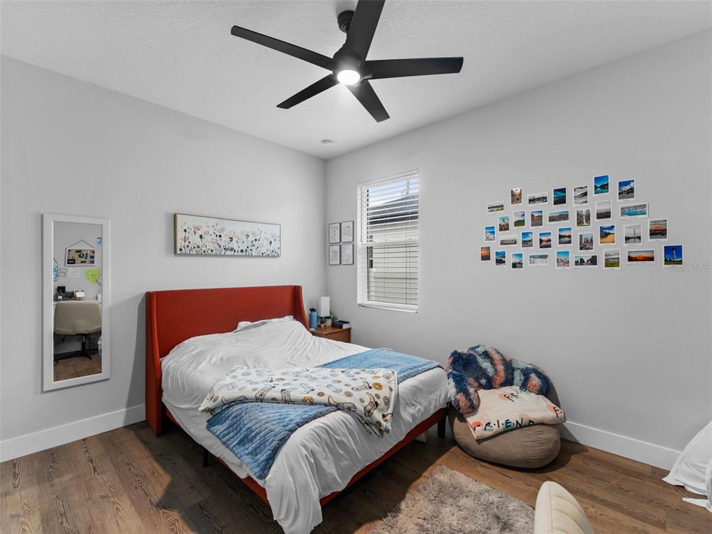 3103 West Leroy Street Tampa, FL 33607 - Photo 22 of 29 a bedroom with a bed and dresser