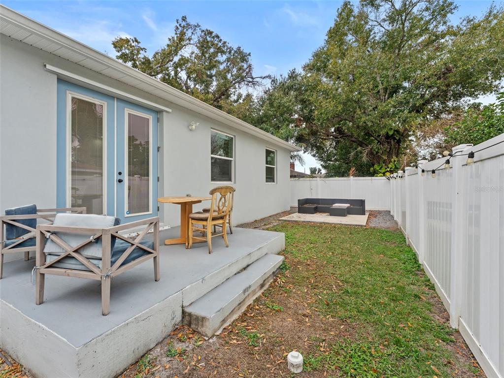 3103 West Leroy Street Tampa, FL 33607 - Photo 26 of 29 a backyard of a house with table and chairs