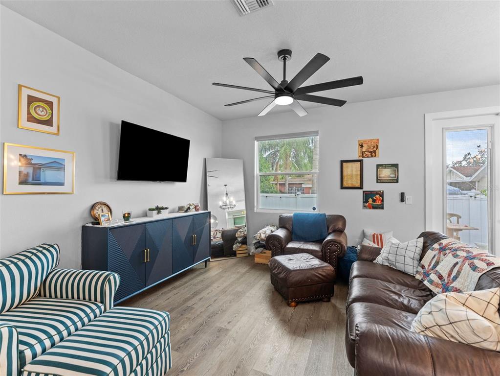 3103 West Leroy Street Tampa, FL 33607 - Photo 5 of 29 a living room with furniture and a flat screen tv