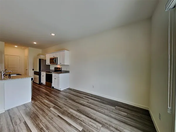 a view of kitchen with wooden floor