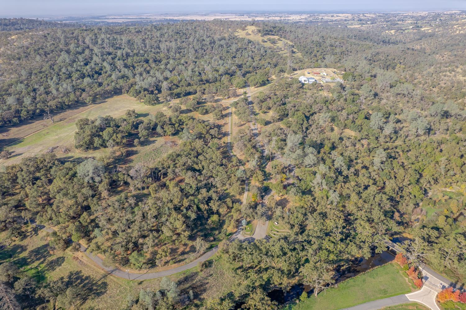 5585 Garden Bar Road Lincoln, CA 95648 - Photo 17 of 26 a view of a field with trees in the background