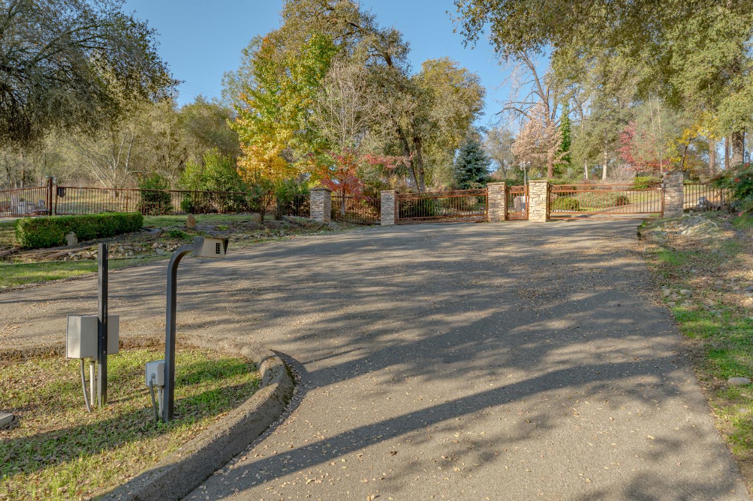 5585 Garden Bar Road Lincoln, CA 95648 - Photo 22 of 26 a street view with large trees