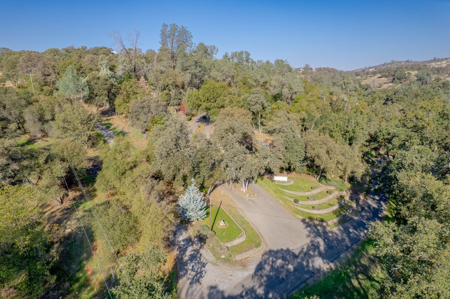 5585 Garden Bar Road Lincoln, CA 95648 - Photo 23 of 26 a view of a house with a mountain and a forest