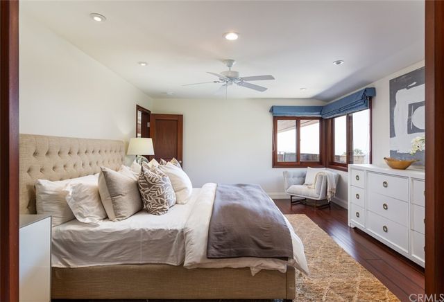 a bedroom with bed and window