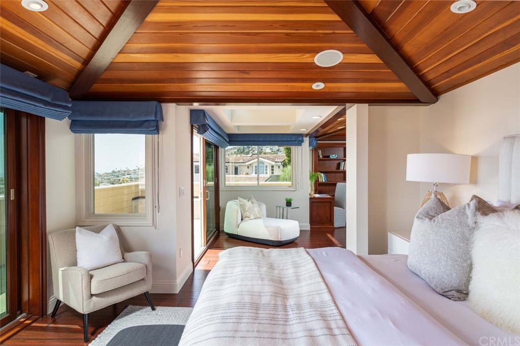 434 Emerald Bay Laguna Beach, CA 92651 - Photo 21 of 39 a bedroom with a large bed and a couch
