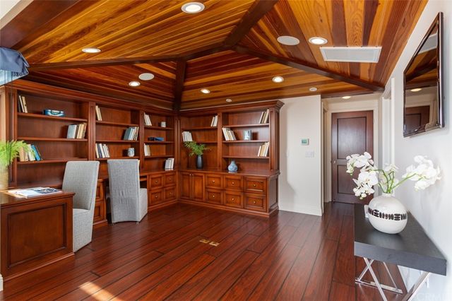 a area with furniture and wooden floor