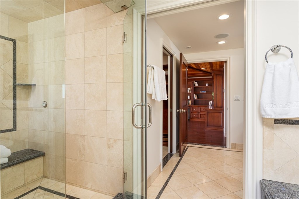 434 Emerald Bay Laguna Beach, CA 92651 - Photo 25 of 39 a bathroom with a shower and a glass door