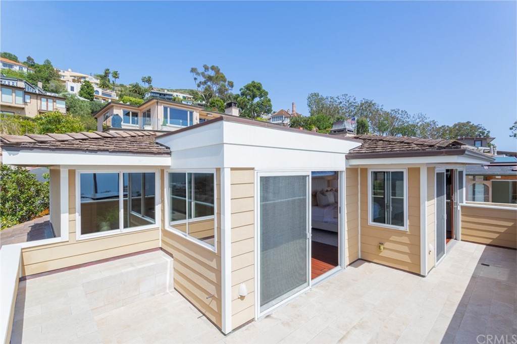 434 Emerald Bay Laguna Beach, CA 92651 - Photo 28 of 39 a view of a house with a balcony and large windows