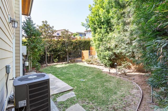 a view of a backyard with sitting area
