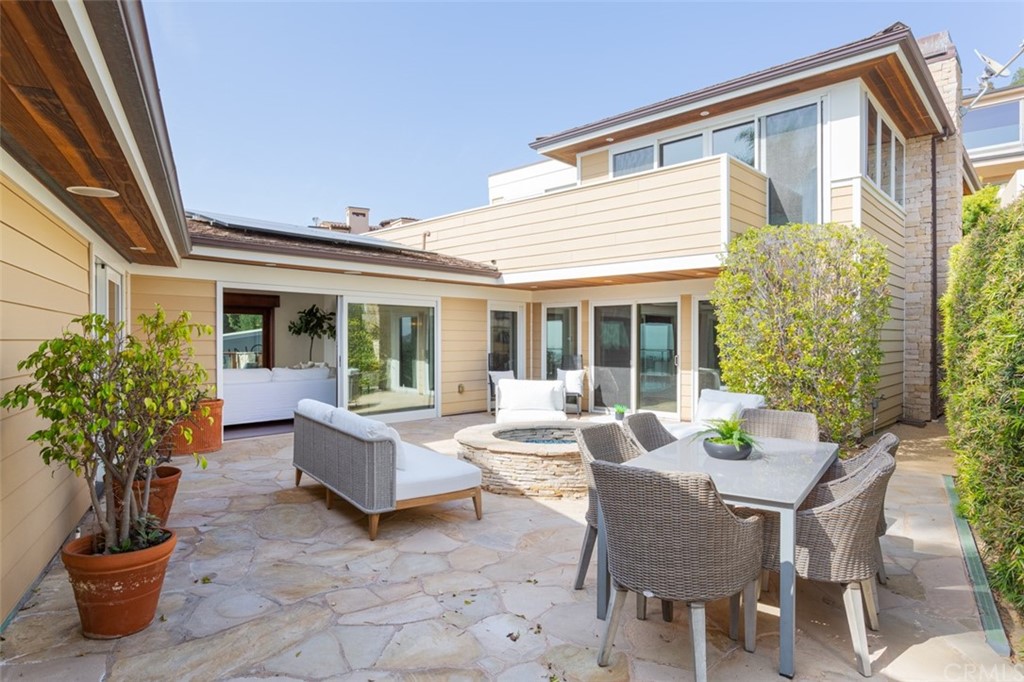 434 Emerald Bay Laguna Beach, CA 92651 - Photo 3 of 39 a living room with patio furniture and potted plants
