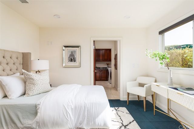 a large white bed in a white room