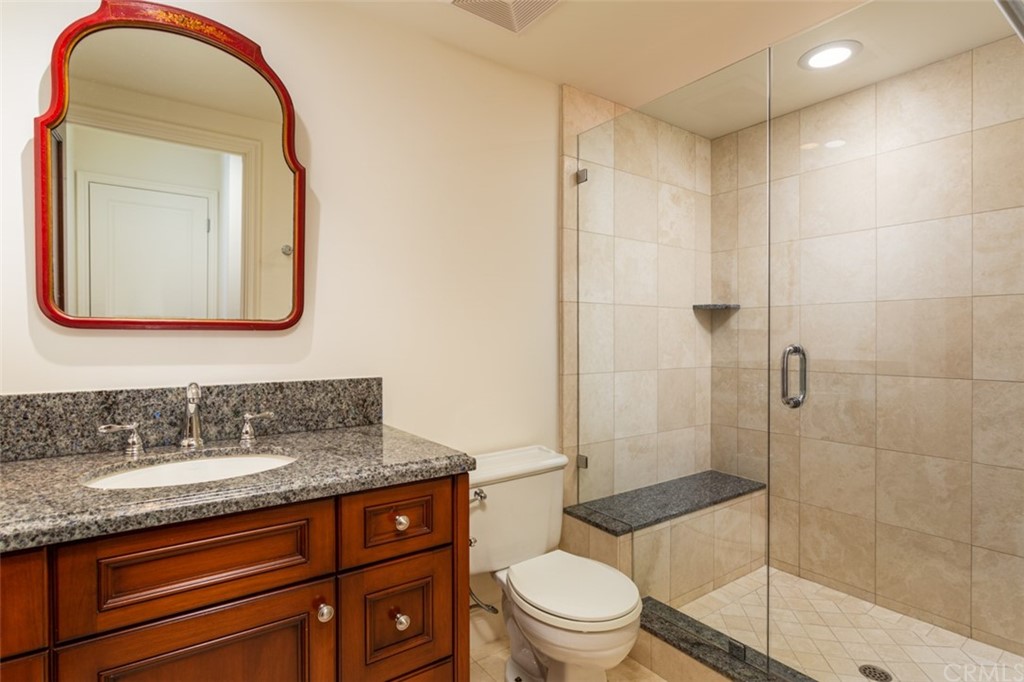 434 Emerald Bay Laguna Beach, CA 92651 - Photo 32 of 39 a bathroom with a sink a toilet and shower