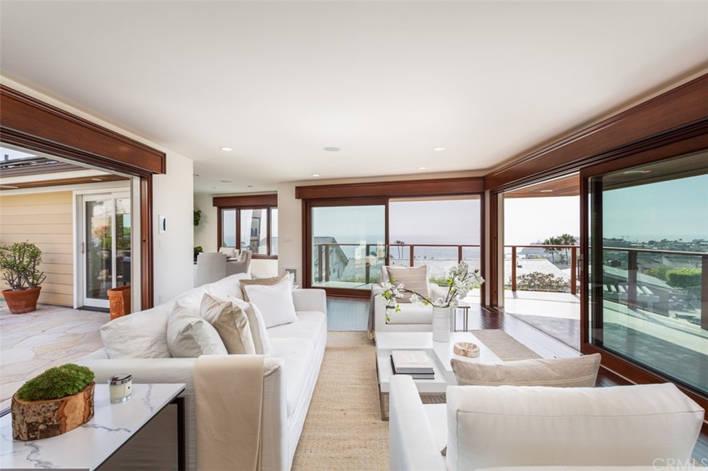 434 Emerald Bay Laguna Beach, CA 92651 - Photo 9 of 39 a living room with furniture and a large window