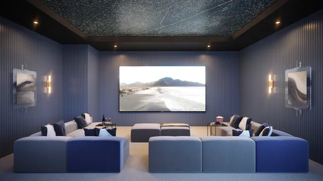 a living room with couches and a flat screen tv