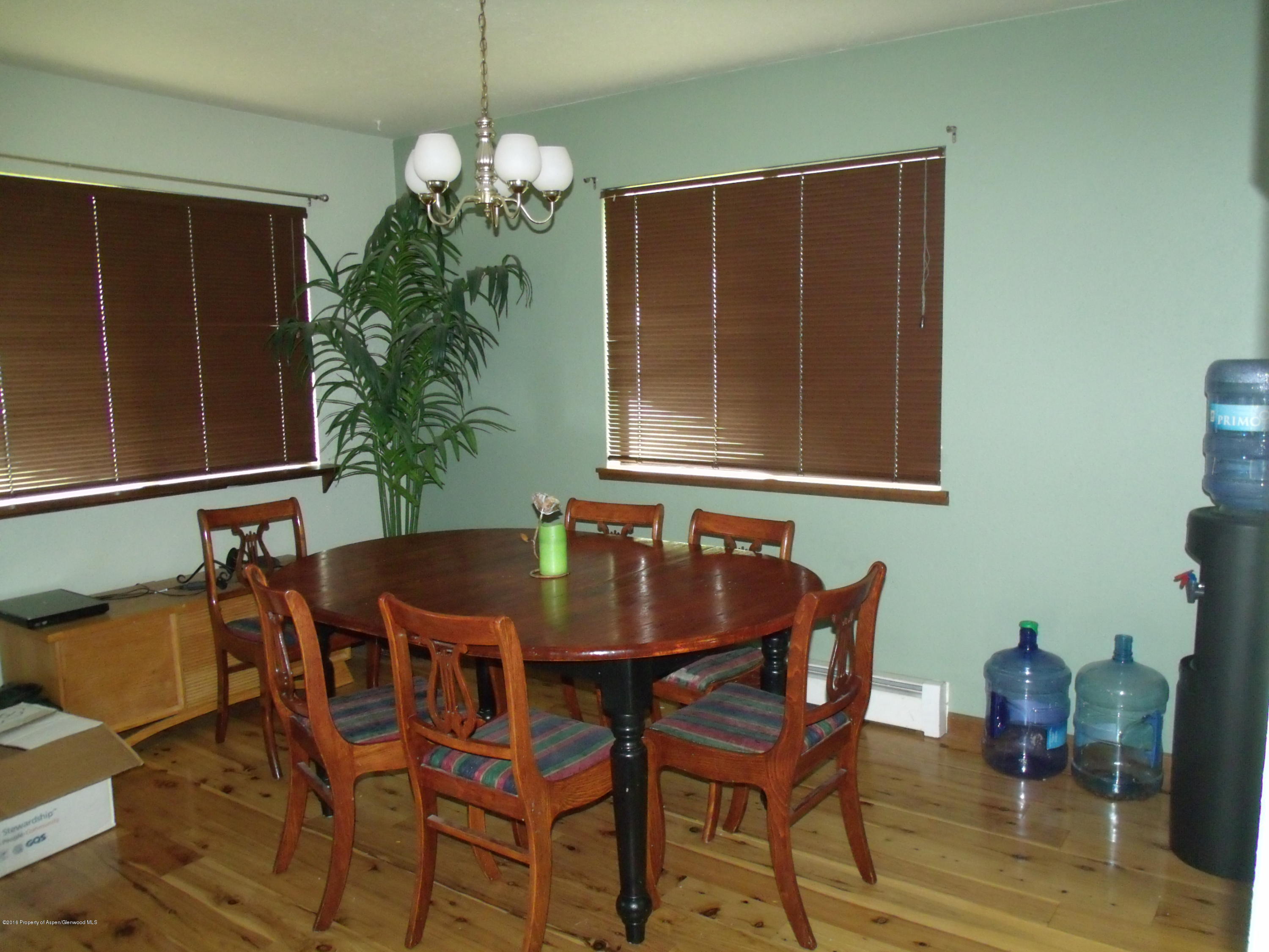 610 Ash Avenue Rifle, CO 81650 - Photo 11 of 18 a dining room with furniture and window