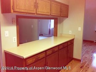 610 Ash Avenue Rifle, CO 81650 - Photo 6 of 18 a kitchen with a sink and cabinets