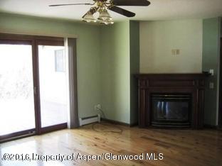 610 Ash Avenue Rifle, CO 81650 - Photo 8 of 18 a view of an empty room with a fireplace