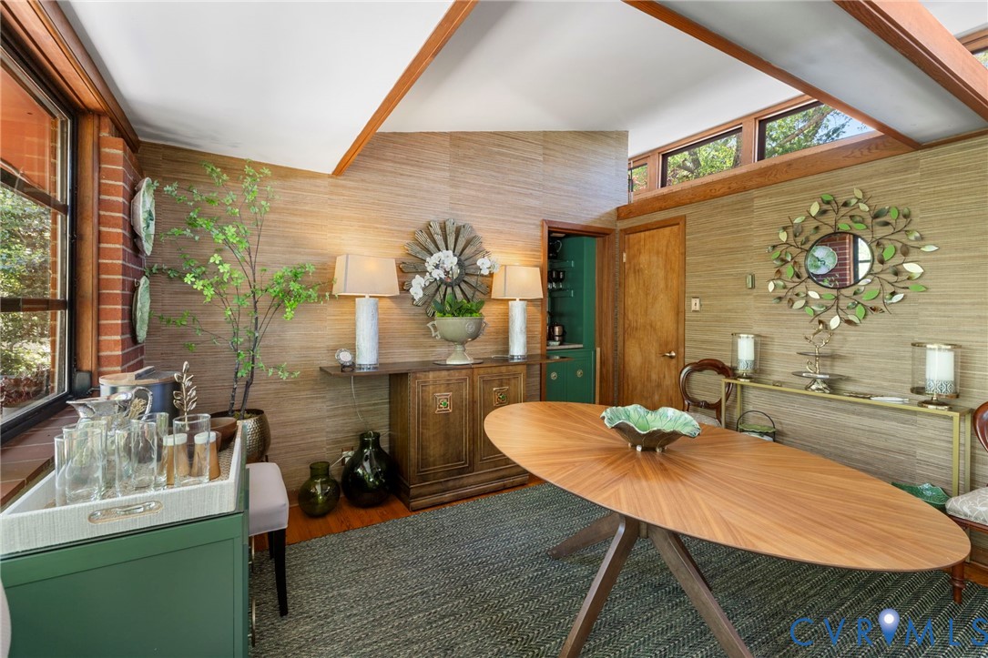 4904 Riverside Drive Richmond, VA 23225 - Photo 15 of 42 a dining room with furniture a rug and wooden floor