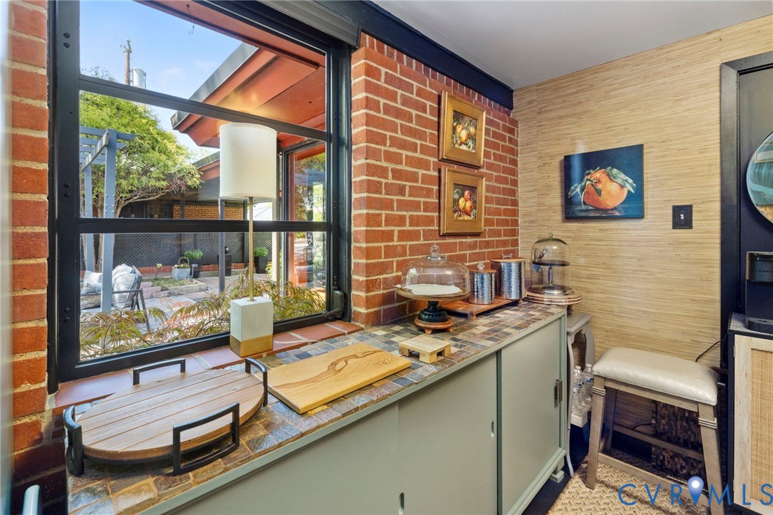 4904 Riverside Drive Richmond, VA 23225 - Photo 24 of 42 a view of a workspace with furniture and a window