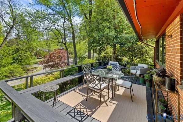 a view of a patio with table and chairs and potted plants