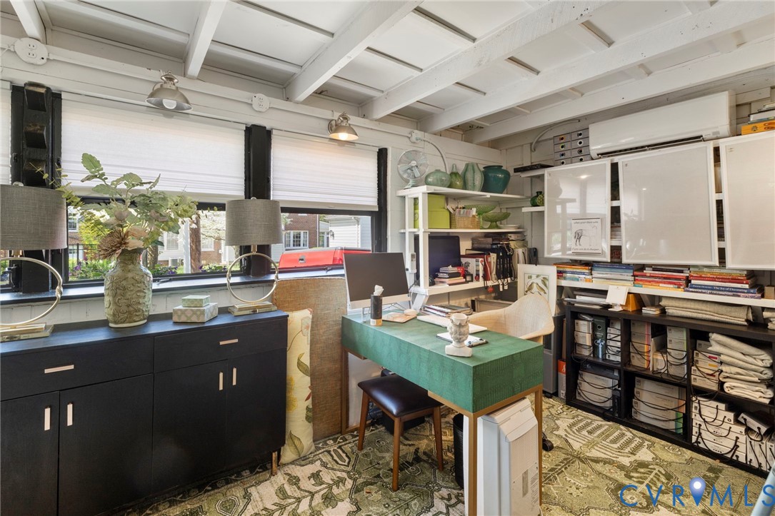 4904 Riverside Drive Richmond, VA 23225 - Photo 39 of 42 a room with stainless steel appliances kitchen island granite countertop a table chairs in it and a large window