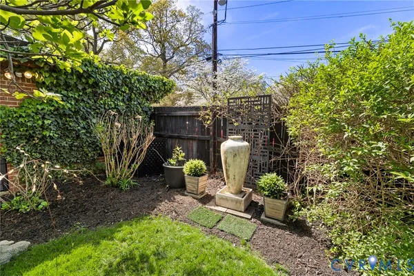 a view of a chairs and table in backyard